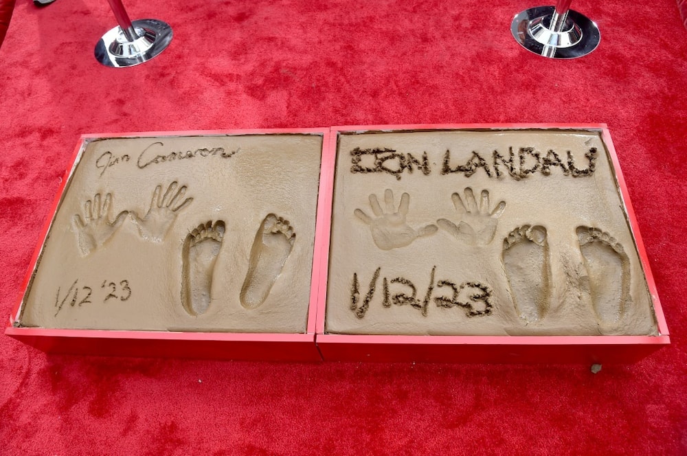 James Cameron and Jon Landau's handprints and footprints were immortalized at a  ceremony honoring 'Avatar: The Way Of The Water' at TCL Chinese Theatre in Hollywood