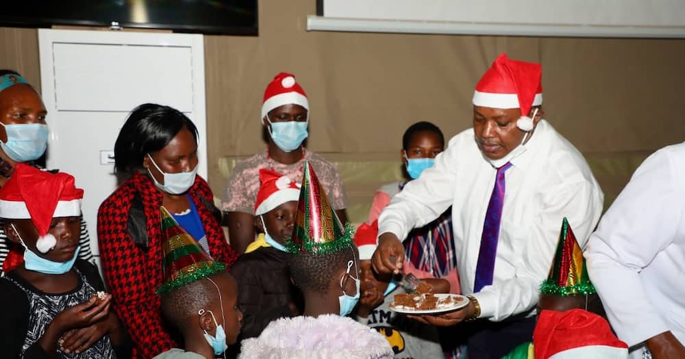 George Kinoti and colleagues host a colourful Christmas party and mass for needy children.