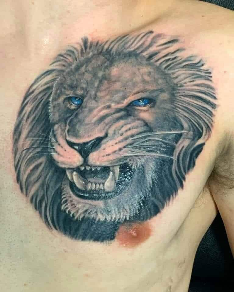 realistic lion tattoo done at Masterpiece tattoo by Brian Martinez