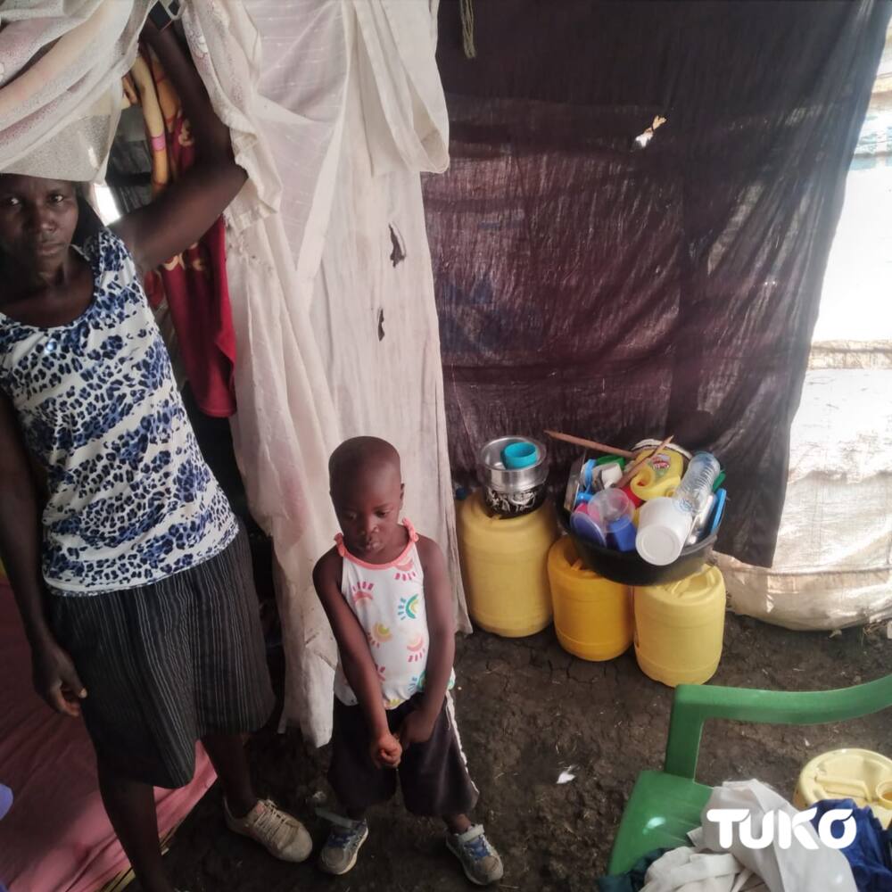 Jackline Aoko and one of her children.Photo: Naomi Wandede.