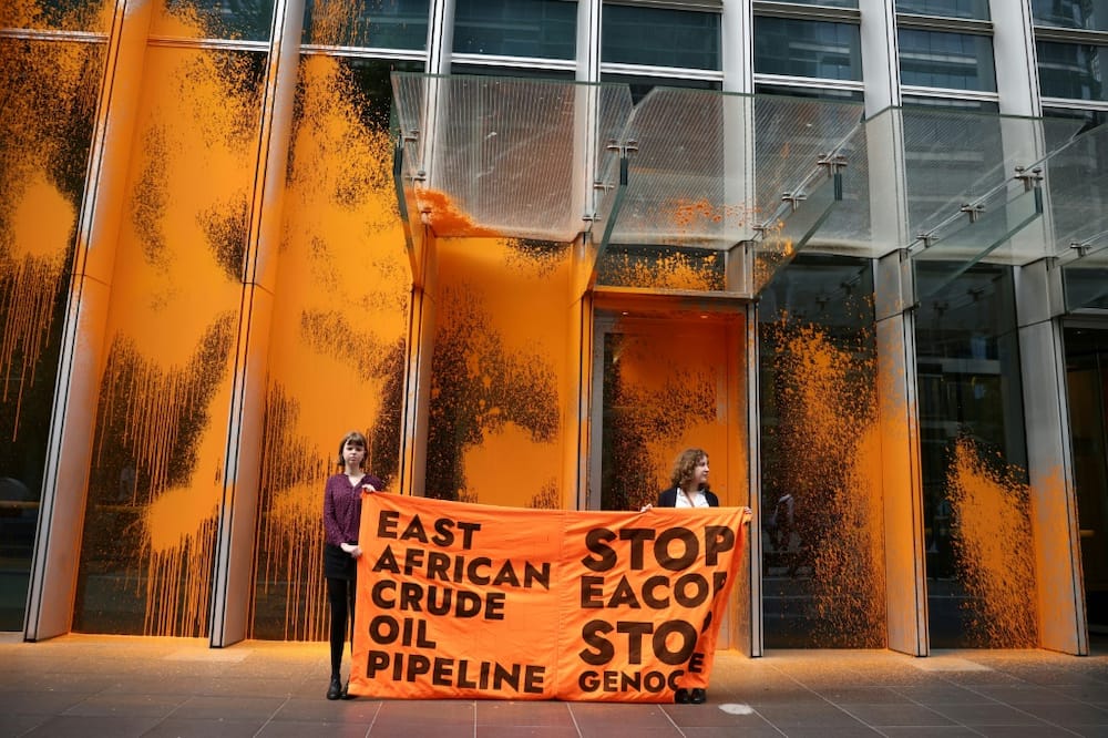Campaigners targeted the UK headquarters of TotalEnergies with paint to protest a pipeline bringing crude oil to the Tanzanian coast through several protected nature reserves