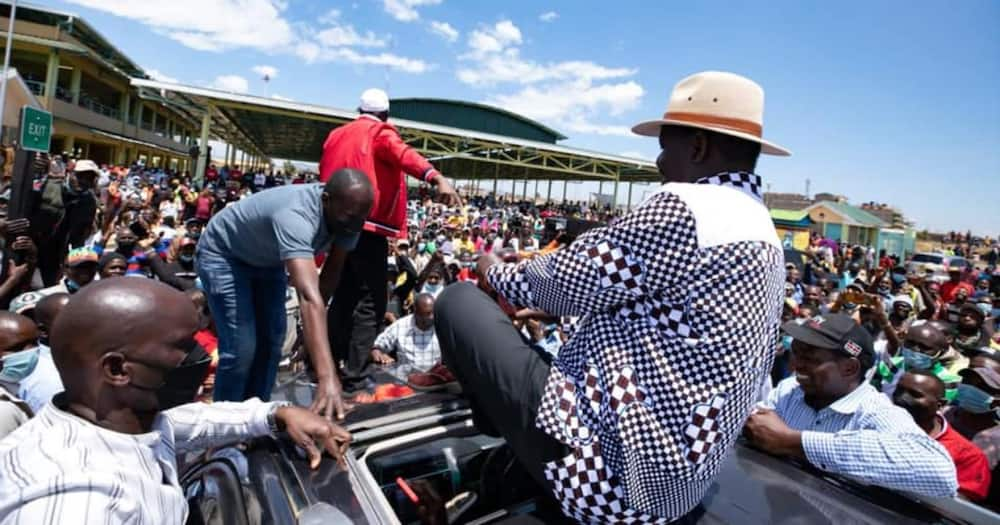 Raila Odinga is gifted a pair of shoes and two armbands.