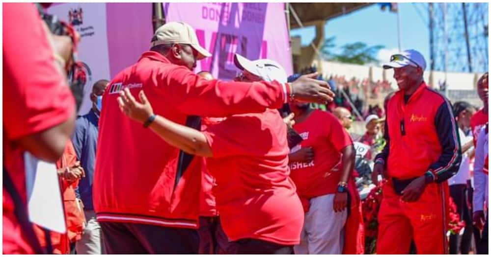 Uhuru Kenyatta Warmly Kisses Wife Margaret after Her Win in Nairobi City Marathon