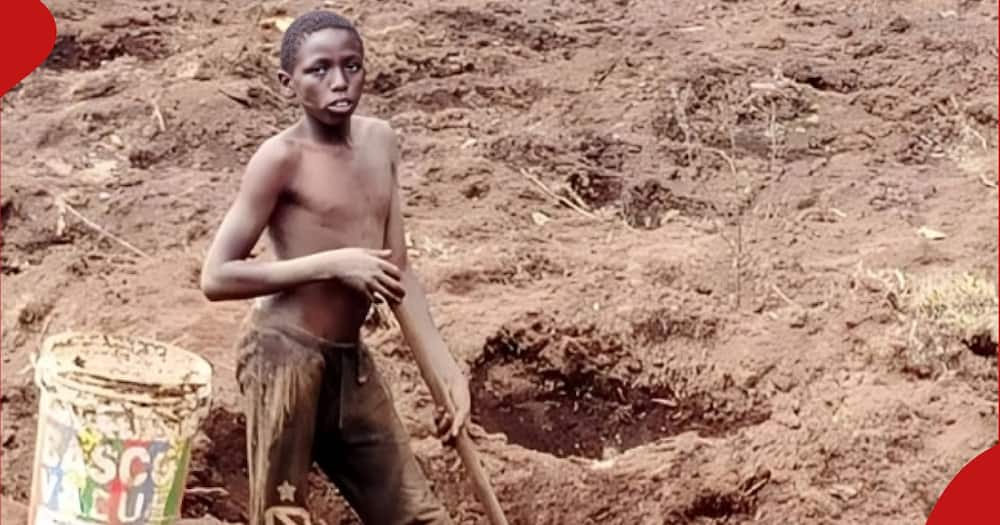 Bomet boy digging pit latrine.