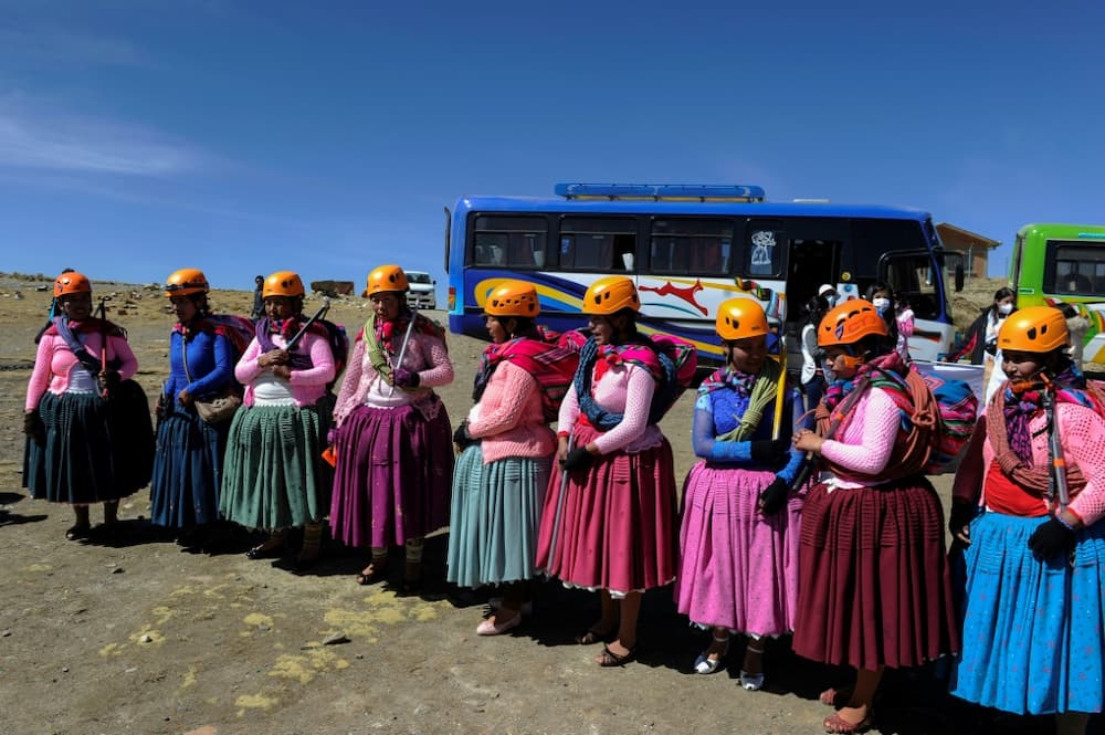 The Aymara indigenous women members of the Climbing Cholitas of Bolivia Warmis make a colourful spectacle as they arrive at the base of the 6.088-metre Huayna Potosi mountain