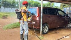 Homa Bay: Single Father Living in Car Wash Store with 3 Children Carries Daughter to Work Daily