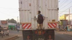 Photo of Boy Hanging onto Lorry to Reach School Warms Hearts Online: "He's Determined"