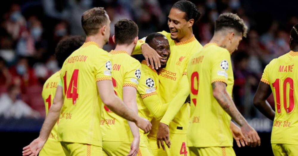 Naby Keita of Liverpool FC celebrates 0-2 with Virgil van Dijk of Liverpool FC during the UEFA Champions League match at the Estadio Wanda Metropolitano on October 19, 2021 in Madrid Spain (Photo by David S. Bustamante/Soccrates/Getty Images)