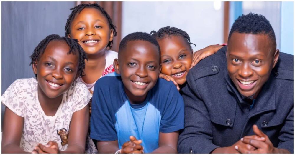 Oga Obinna shows off his kids.