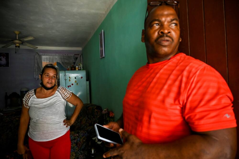 Elizabet Leon Martinez, who has had three children imprisoned for anti-government protests, and Luis Wilber Aguilar, whose son Wagniel Aguilar is also serving time for the same reason, are seen in the neighborhood of La Guinera on the outskirts of Havana in June 2022