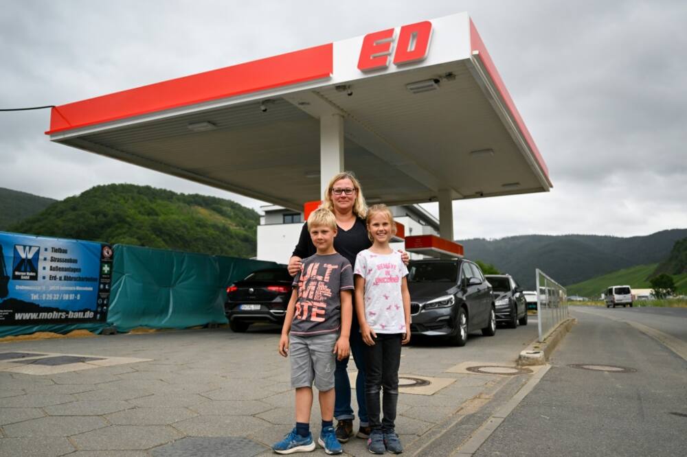 Petrol station owner Carina Dewald with her son Elias and niece Mara