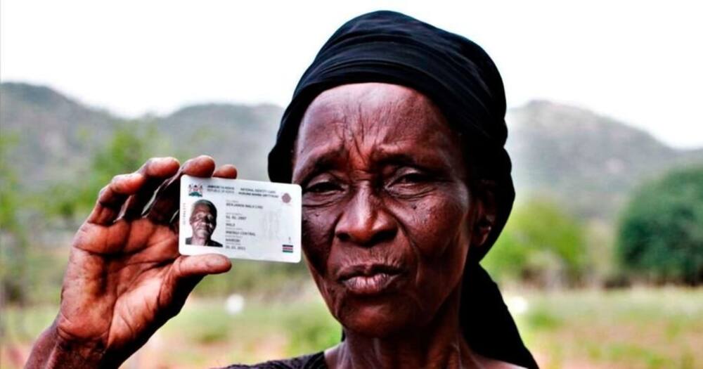 Ms Kamene Katunduma displays her elder brother Benjamin Malii Livu’s Huduma Namba card. Photo: Nation.
