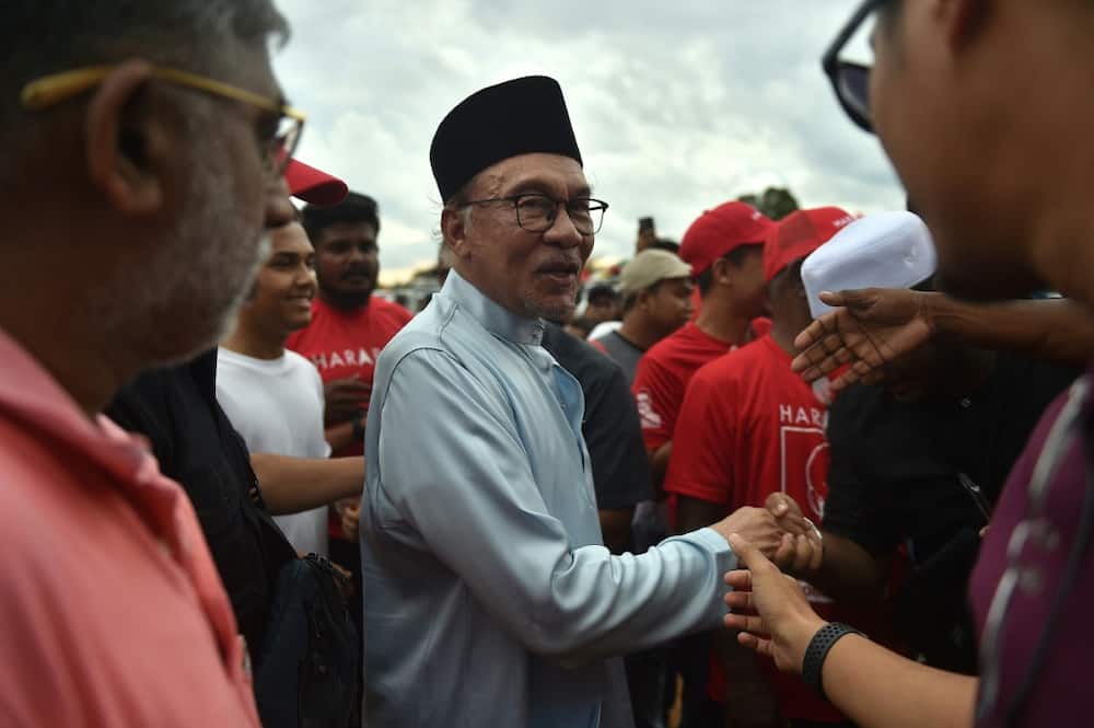 With age catching up, this election could be Anwar Ibrahim's (C) last chance to fulfil a 20-year dream to lead Southeast Asia's third-largest economy
