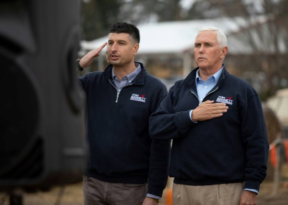 Former US vice president Mike Pence, right, at a November 4, 2022, campaign appearance in Michigan