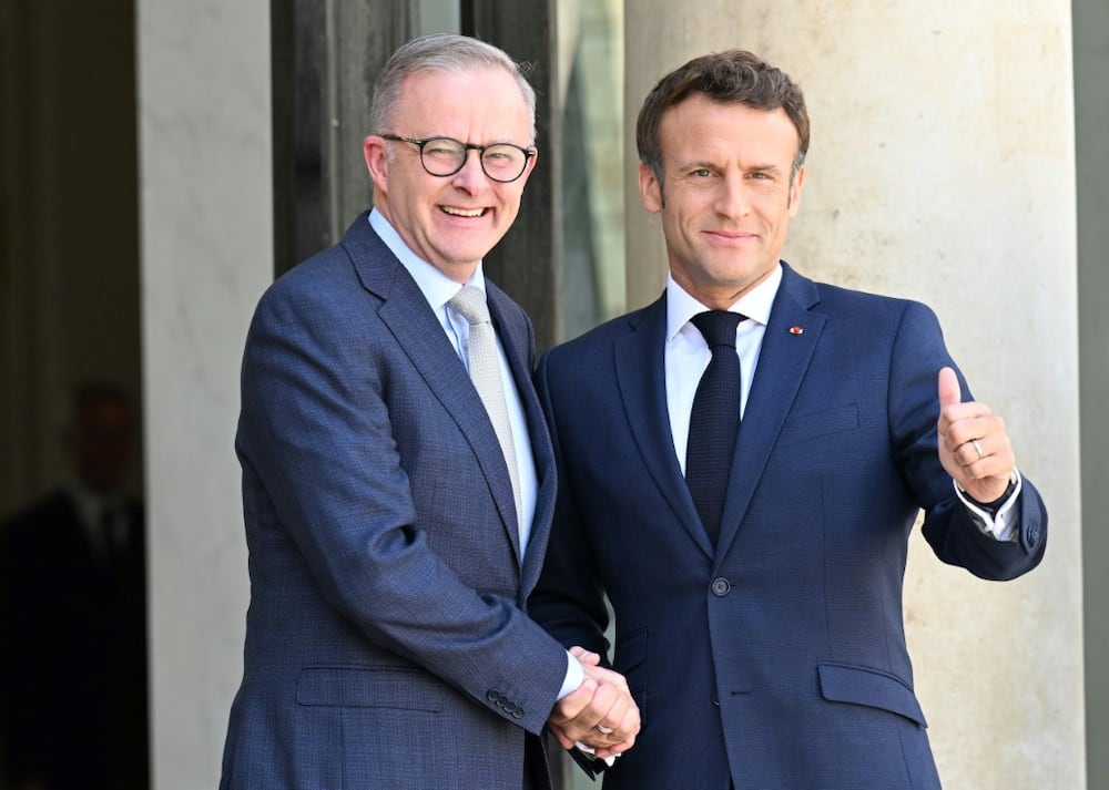 Australia's Prime Minister Anthony Albanese (l) spoke of a 'new start' in relations with France after greeting President Emmanuel Macron in Paris