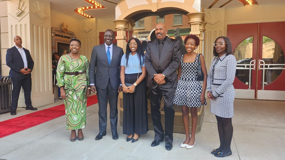 President William Ruto and his family pose for a photo with Steve Harvey.