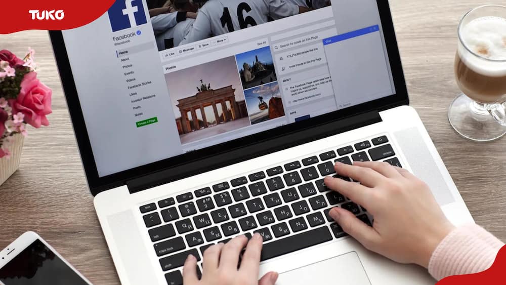 A person accessing Facebook on their laptop