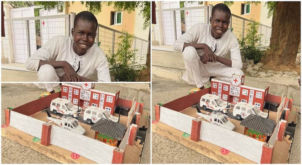 Aji Bukar presents the architectural design as a gift to the International Committee of the Red Cross in Nigeria.