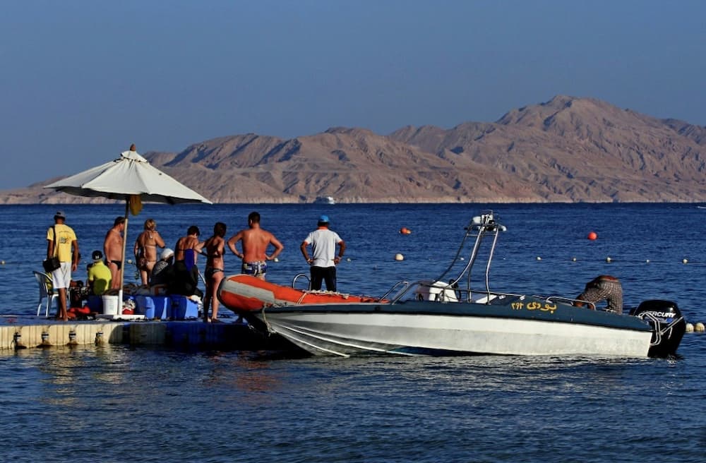 Tourists pictured in 2015 boarding a boat near Tiran, an island that is un-inhabited, except for peacekeepers
