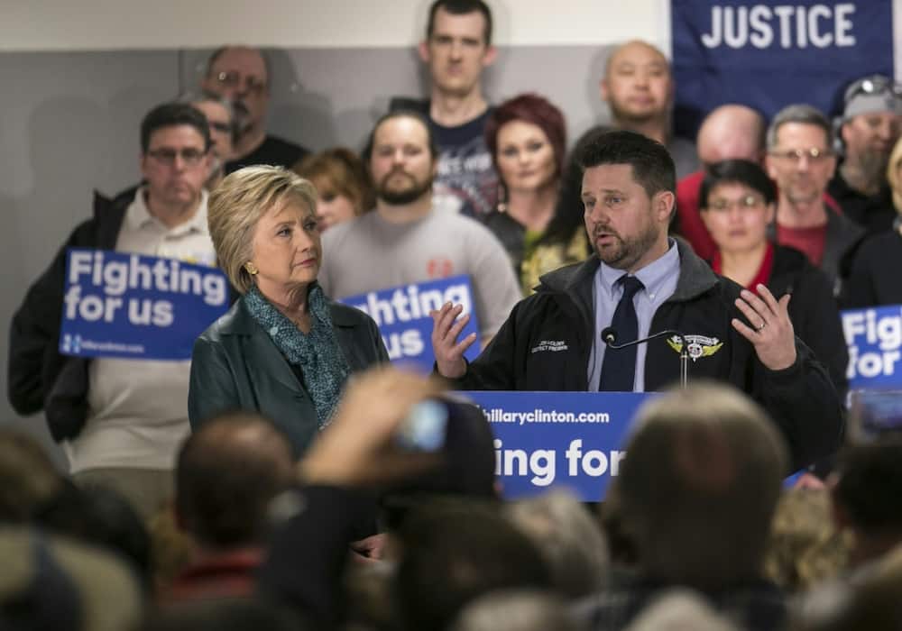 Jon Holden -- seen here with Hillary Clinton in March 2016 -- is president of the International Association of Machinists and Aerospace Workers for District 751, which represents some 30,000 Boeing workers