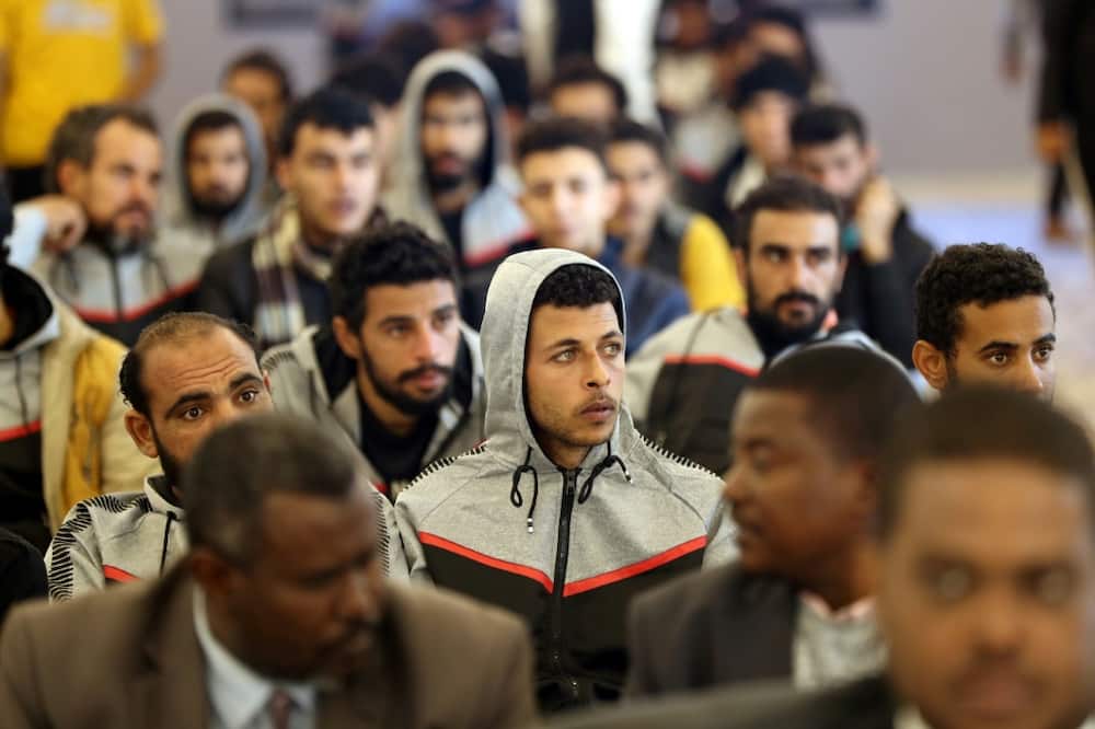 The migrants were dressed in differing tracksuits to identify their nationalities