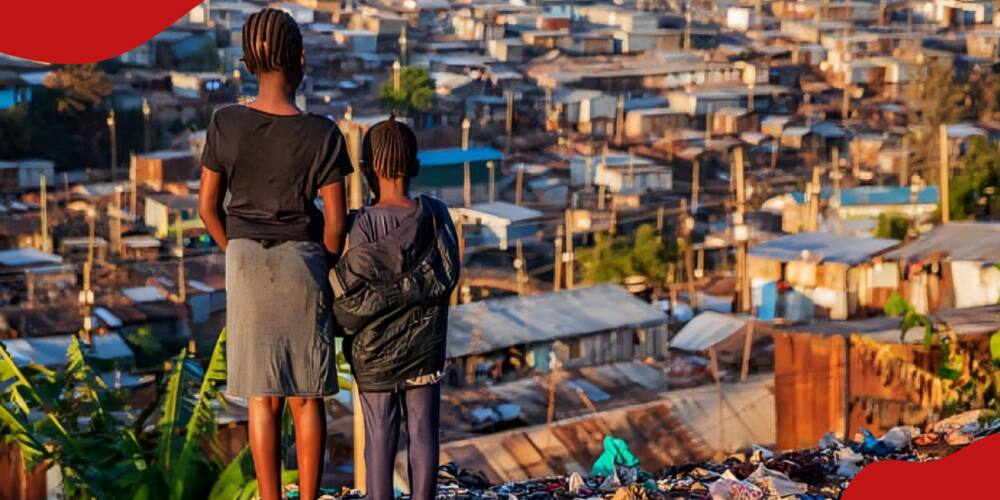 Photo of little girls standing in trash and looking at houses in Kibera slum.