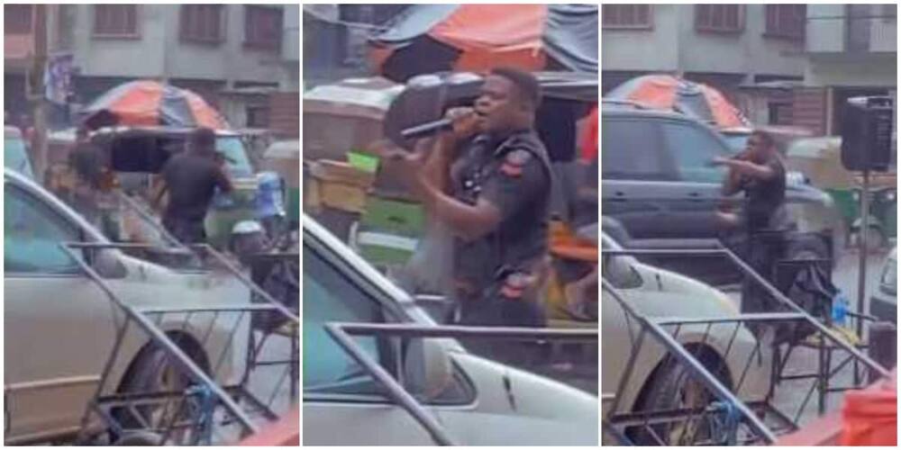 Police officer defies rain to preach the gospel on busy road in Aba, video goes viral