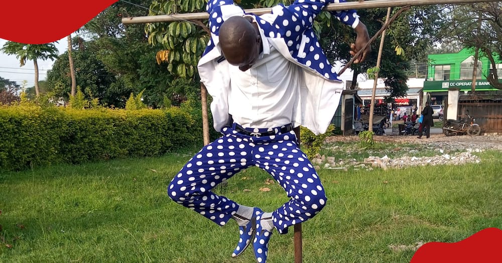 Chris Embarambamba swinging on a pole during the creation of a music video