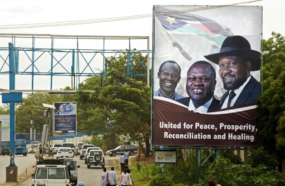 April 2016: Machar, centre, and Kiir, right, send a message of unity