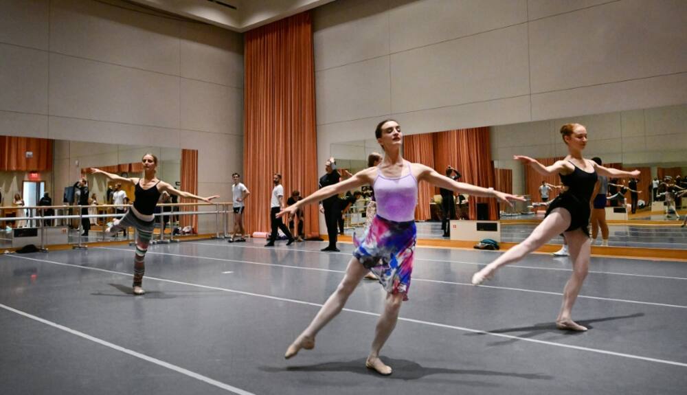 Joy Womack (C) and fellow dancers rehearse at the Segerstrom Center for the Arts in Costa Mesa, California
