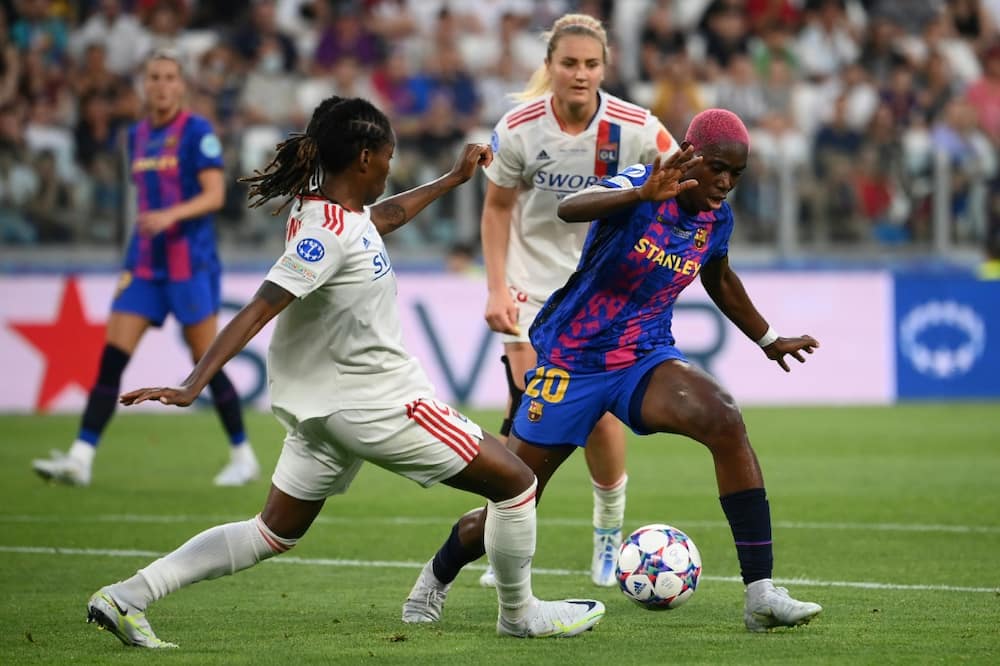 Nigeria star Asisat Oshoala (R) playing for Barcelona against Lyon in the Women's European Champions League final in Turin on May 21, 2022.