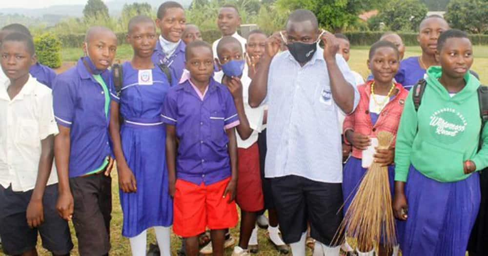 Deogratius Sanyu with his former classmates.