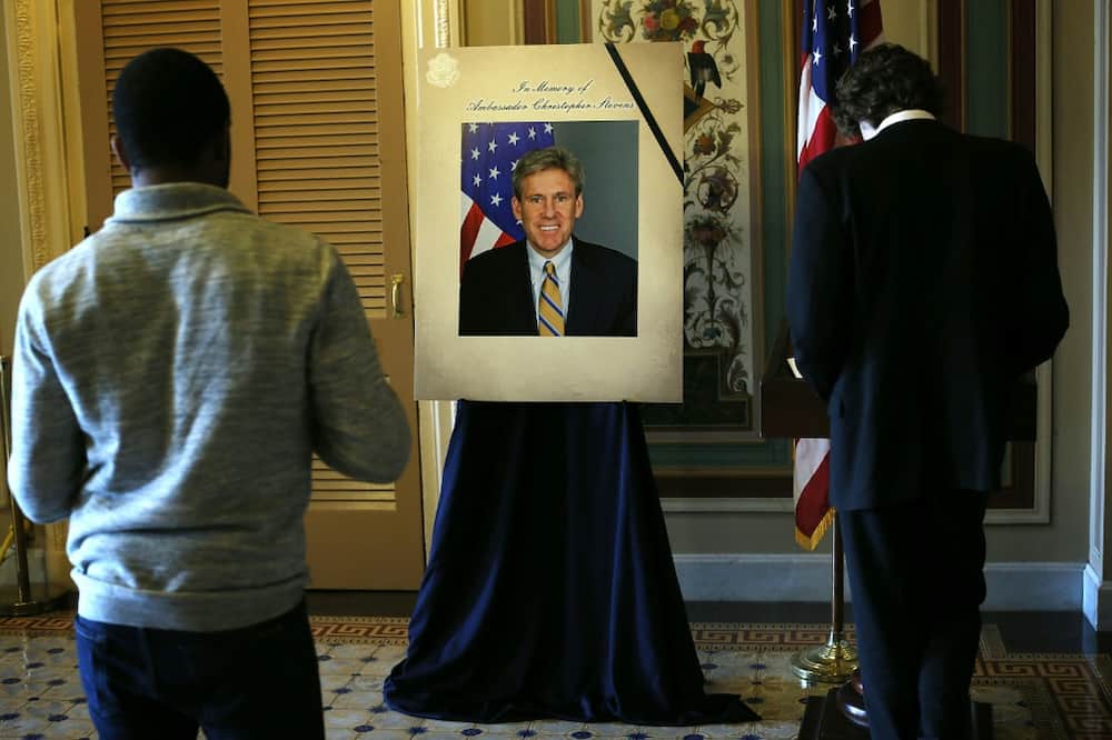 A condolence book and a picture of US ambassador Christopher Stevens are displayed at the Capitol on September 14, 2012, after he and three other Americans were killed in the Benghazi attack