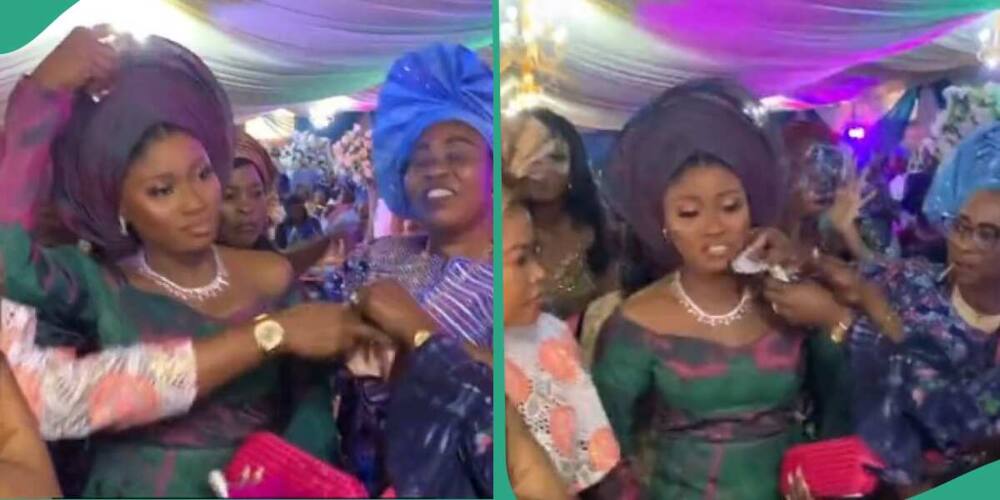 Confusion as bride's sister stops woman from spraying money on her.