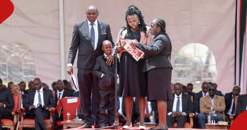 Kelvin Kiptum's wife reads tribute to husband next to her son.