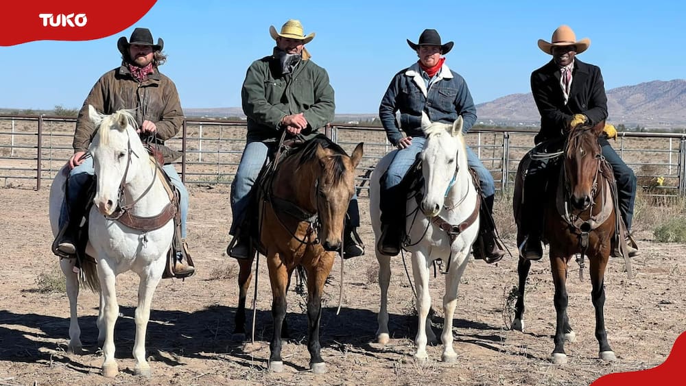 UFO Cowboys cast members pose for a photo while riding horses