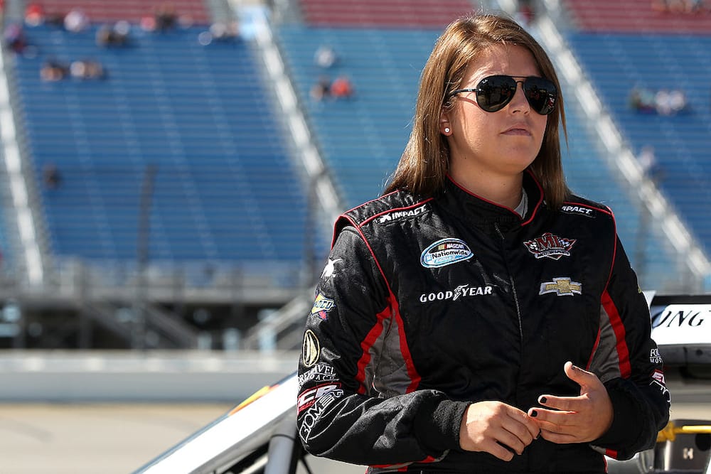 Johanna Long stands on pit road during qualifying for the NASCAR Nationwide Series Dollar General