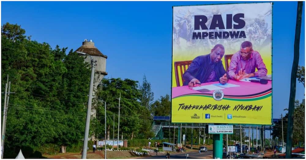 Eliud Owalo erects billboards