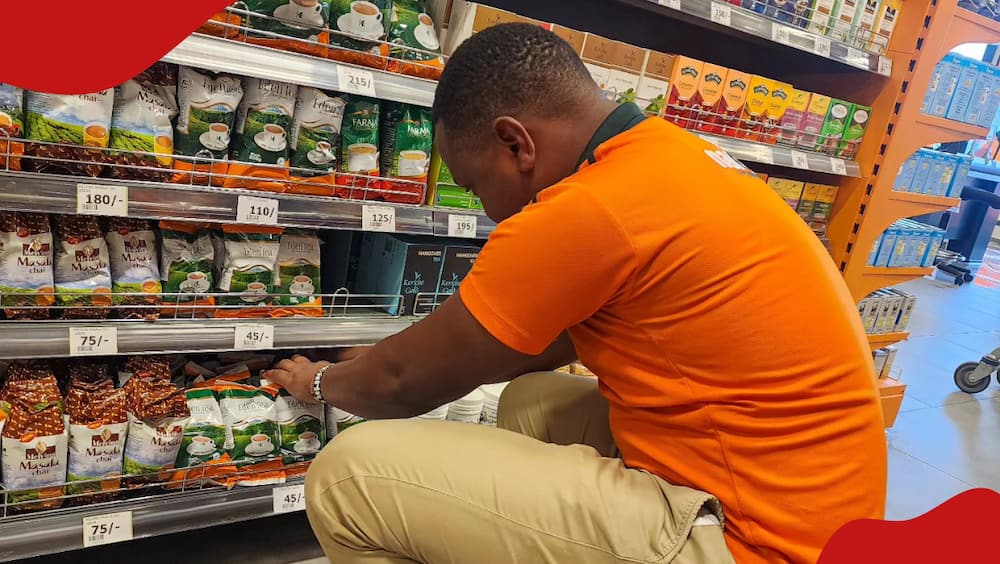 A Naivas attendant puts final touches on the chain's newest branch at Thika Road Exit Five ahead of its opening.