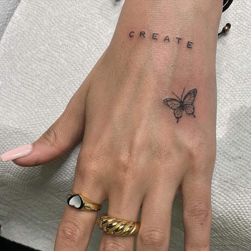 small butterfly tattoos on hand