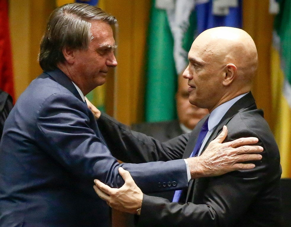 Brazil's President Jair Bolsonaro, right, is no fan of Supreme Court justice Alexandre de Moraes, left, who will act as referee in upcoming elections