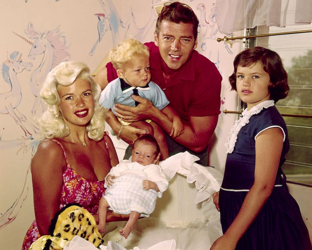 American actress Jayne Mansfield (1933 - 1967) with her husband Mickey Hargitay, and children Jayne Marie (right), Miklos and baby Zoltan, 1960.