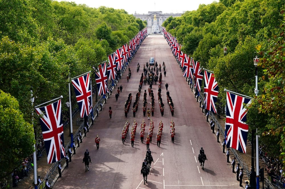 The queen's lying in state follows a grand procession through the flag-lined heart of London