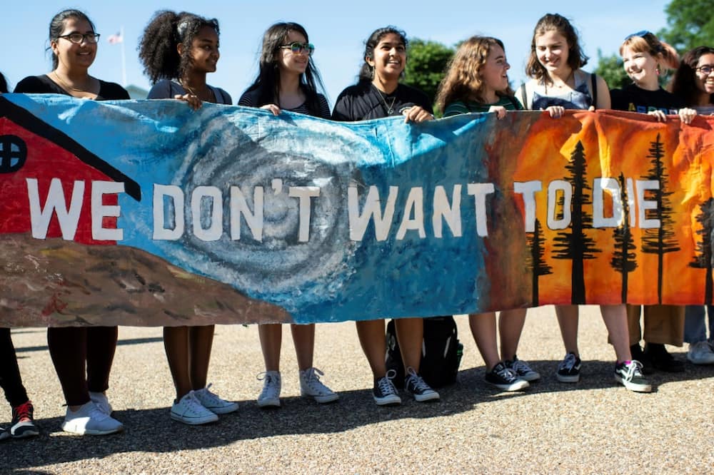 Young Americans protest outside the White House in Washington, DC during a "Fridays for Future" march in 2019