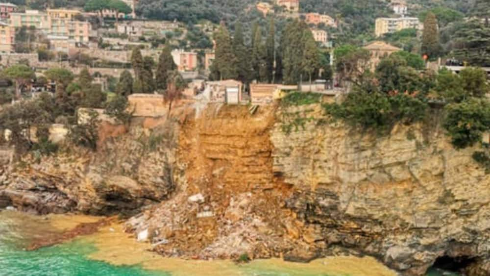 Hundreds of coffins fall into the sea after landslide causes collapse of cemetery