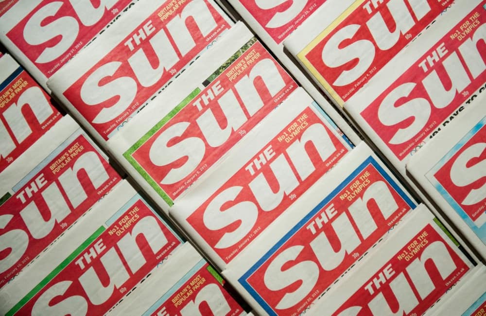 Rupert Murdoch turned Britain's The Sun tabloid into a money-maker with lurid headlines, a strongly conservative tilt, and pictures of topless women on page 3