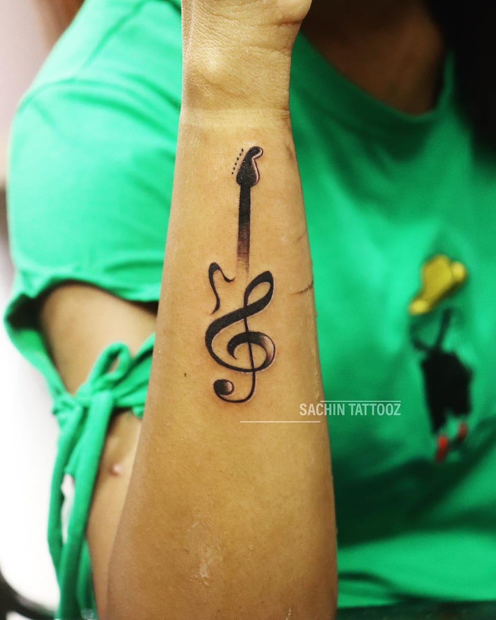 women's music tattoo