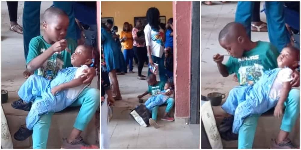 Young boy hailed for caring for sister while their mum was away. Photo Credit: Screengrabs from video shared by Alisigwe Amarachi.