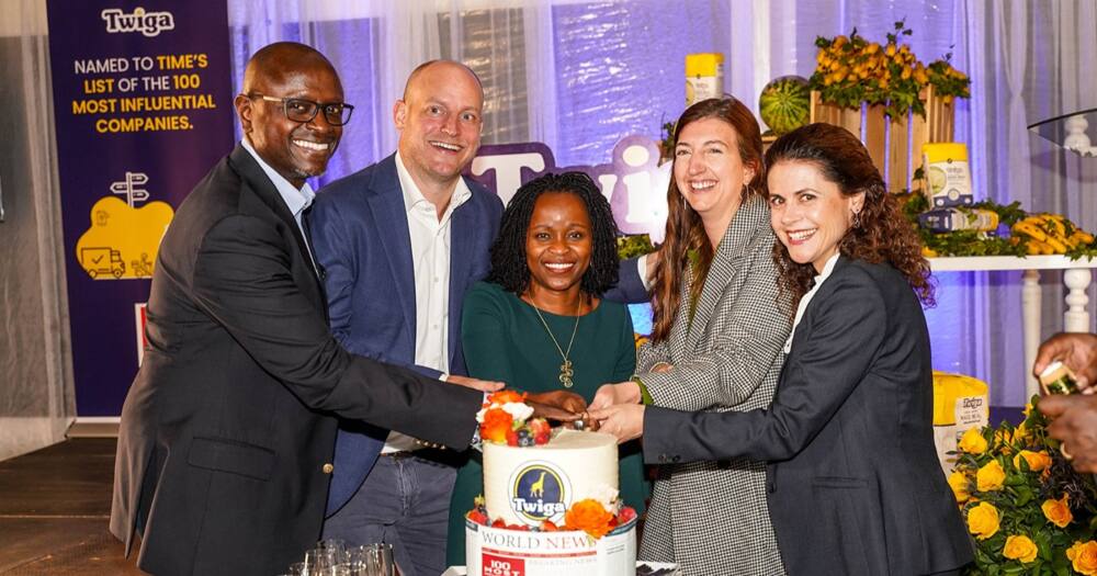 Twiga Foods MD Peter Njonjo and other officials cutting a cake in a past event.