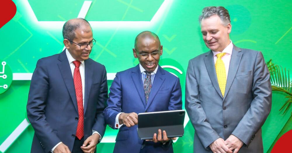 Safaricom board members interact with CEO Peter Ndegwa.